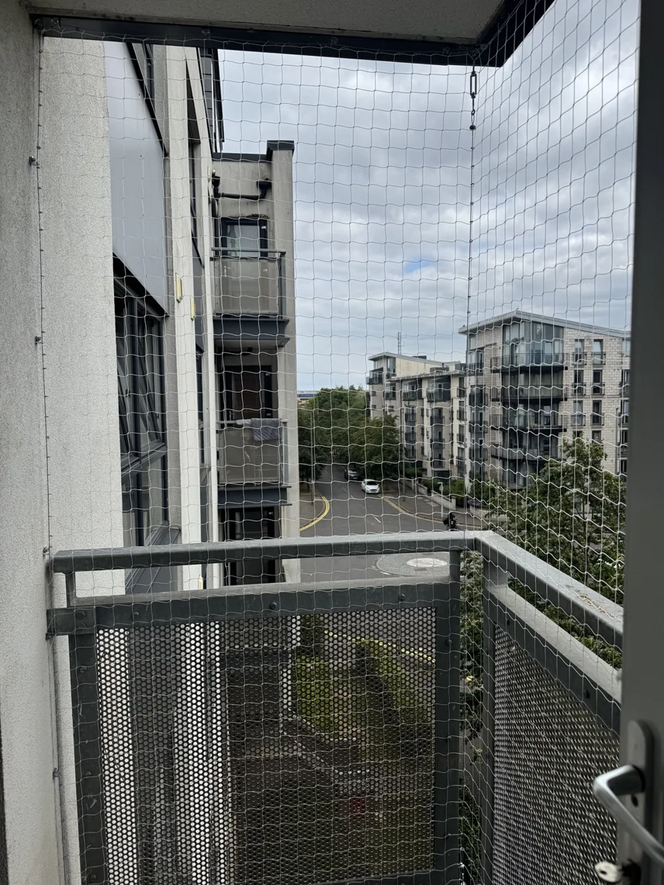 Bird netting fitted across a residential balcony opening